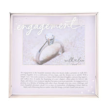 Load image into Gallery viewer, Framed picture of an engagement ring with sand and text on a white background