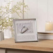 Load image into Gallery viewer, Decorative frame with an engagement ring on a wooden surface
