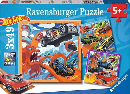 Hot Wheels Ravensburger puzzle packaging with colorful illustrations of cars and a dragon.
