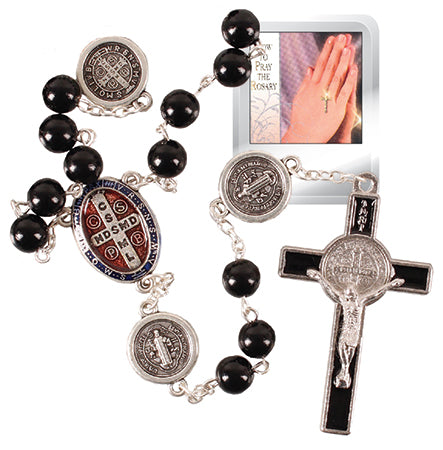 Black rosary with silver beads and cross, featuring St. Benedict medals, on a white background.