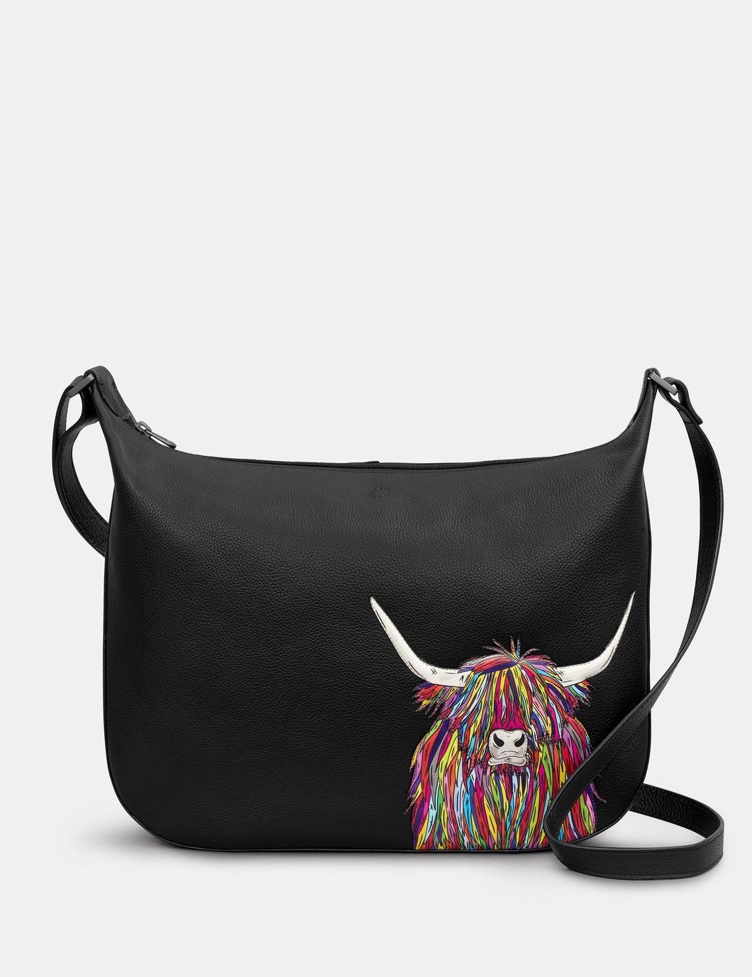 Black handbag with a colorful highland cow design on a white background