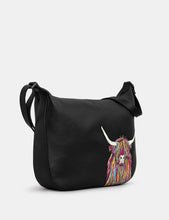 Load image into Gallery viewer, Black shoulder bag with a colorful cow design on a white background
